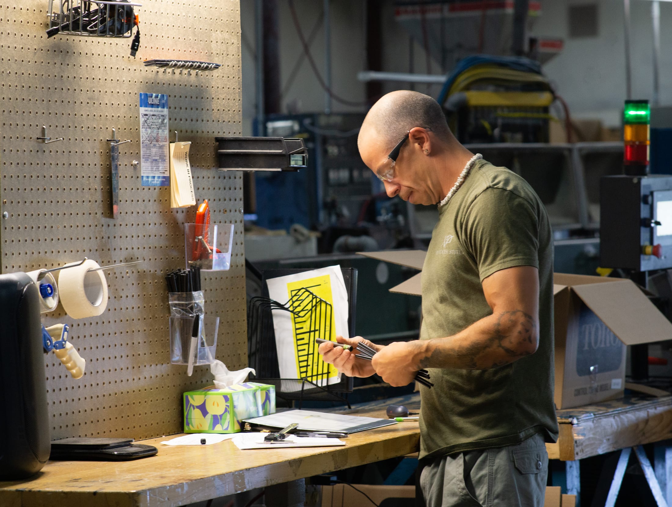 Hamilton facility team member checking workbench materials
